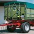 Front view with roll-up tarpaulin, platform and 250 mm high fixed triangular attachment wall