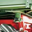Dump bearing lock with cross-over protection latch